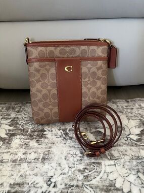 Brand new never used Coach Tan and Brown Signature Crossbody
